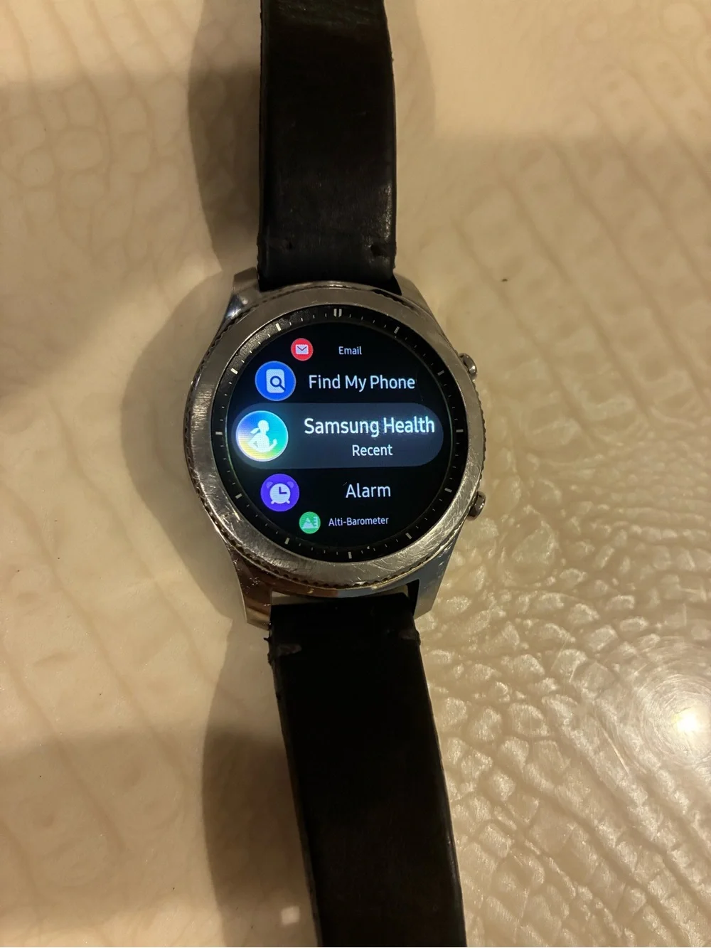 Samsung Silver Smartwatch with Black Strap and Blue Display